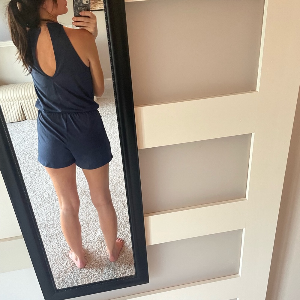 Navy open back romper with pockets